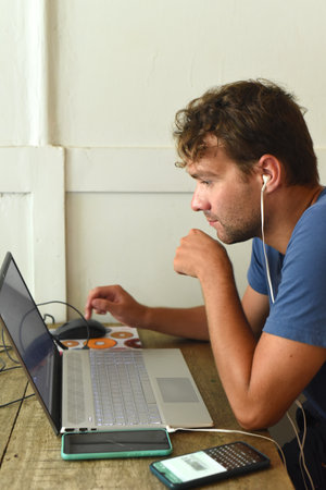 Young digital nomad working in a cafeの写真素材