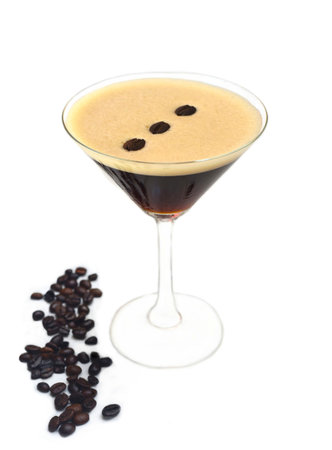 Espresso martini with coffee beans on white background