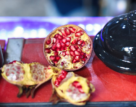 Ripe peeled Pomegranate fruit on a tableの写真素材