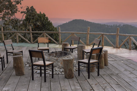 Many chairs and fire place under sunset against mountain view in Da Lat Vietnamの写真素材
