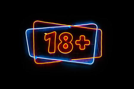 Neon light sign with 18 plus text on black background