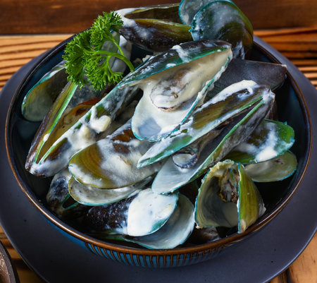 Dish with oysters in creamy sauce in bowl close upの写真素材