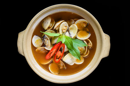 Steamed clams or clam soup cooked in vietnamese style isolated on black background top viewの写真素材