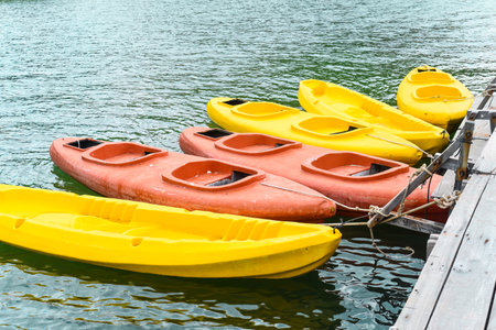 Many colorful kayaks floating in sea in Vietnamの写真素材
