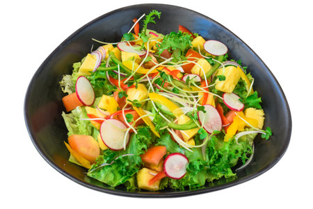 Vegetarian salad with radish, arugula, pineapple and tomatoes isolated on white backgroundの写真素材