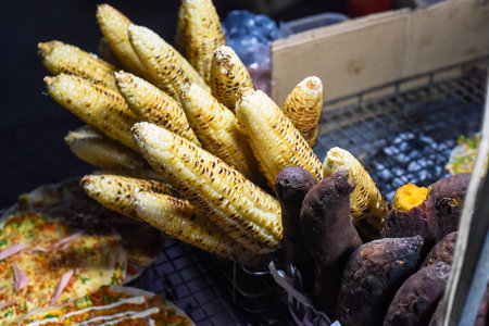 Grilled sweet potato and corn in vietnamese night market in Da Latの写真素材