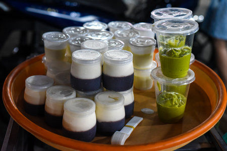Fresh homemade strawberry yogurt and matcha in vietnamese night market in Da Latの写真素材