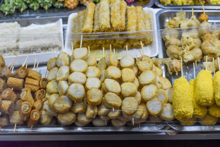 Many snacks and seafood in vietnamese night market in food festivalの写真素材