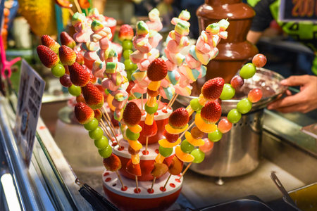 marshmallow and strawberry with grape on sticks for fondueの写真素材