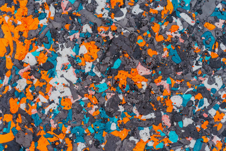Colorful background made of Styrofoam or foam plastic orange, blue white and black colors together