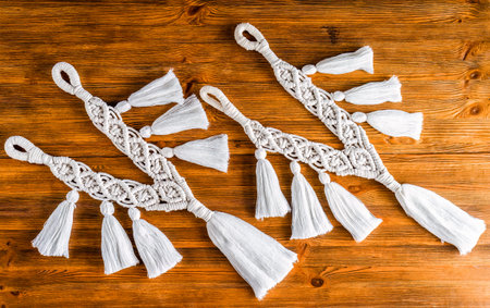 curtain tieback in boho style on wooden shelf