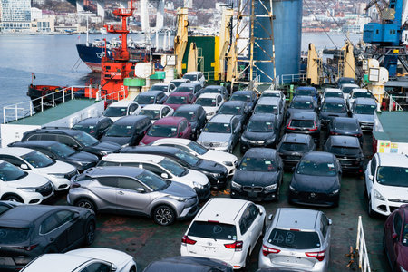 Vladivostok, Russia - 3 March 2024: unloading of new car from the ship in sea port of Vladivostok,...
