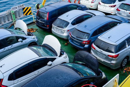 Vladivostok, Russia - 3 March 2024: unloading of new car from the ship in sea port of Vladivostok, Russiaのeditorial素材