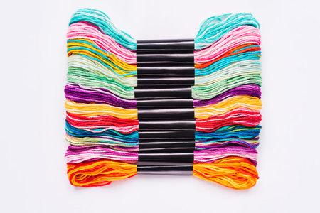 Many skeins of mouline thread for embroidery melange background