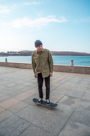 Young man riding a skateboard making tricks and jumps