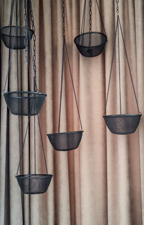 Empty hanging pot for orchids against white bricks wallの写真素材