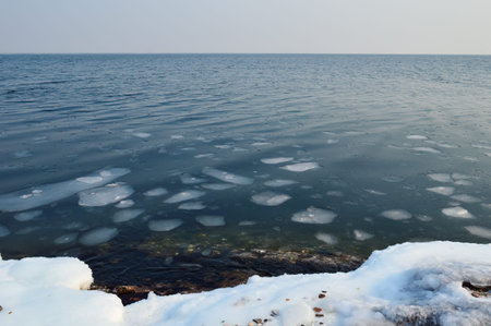 Melting water of frozen Japanese sea with ice and snow