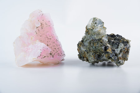 Pink manganoan calcite with cubic fluorite crystal, pyrite inclusions, and galena lead glance,...
