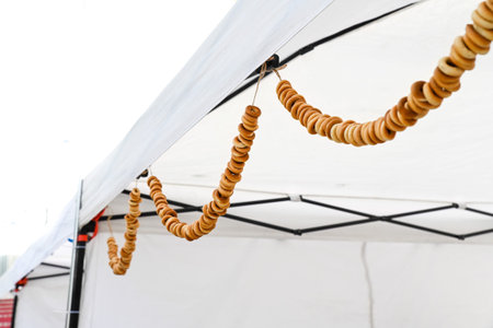 Traditional Slavic decoration made of bubliks hanging on strings. Russian folk culture, symbol of hospitality and rural heritage.の写真素材
