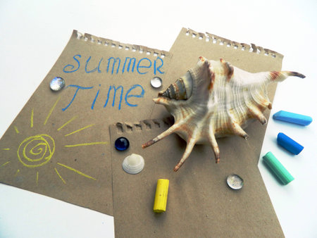 Blank sheets of craft paper covered with multiple colorful felt pen markers, shellsの写真素材