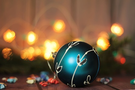 festive decorative blue bauble on christmas tree branchの写真素材