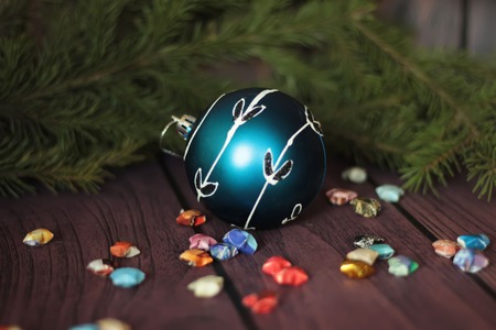 festive decorative blue bauble on christmas tree branchの写真素材
