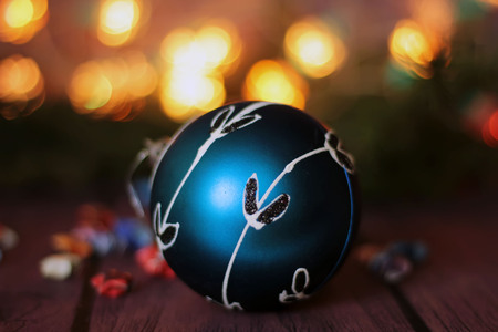 festive decorative blue bauble on christmas tree branchの写真素材