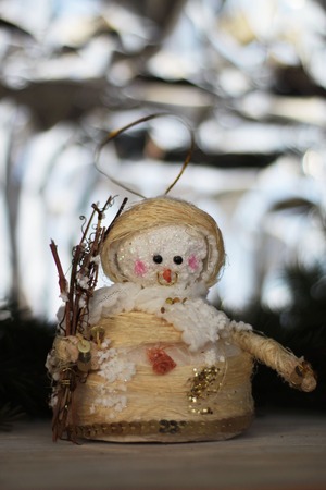 Cute christmas tree snowman decoration and christmas tree as backgroundの写真素材