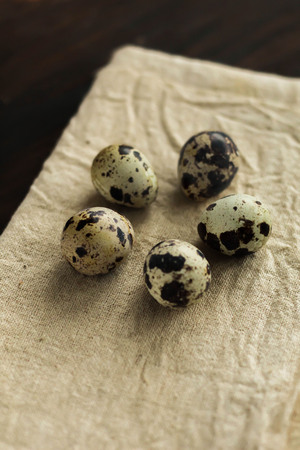 Easter composition of five quail Easter eggs on the old wooden background easter background top viewの写真素材