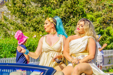 People walking in the 39th Annual Provincetown Carnival Gods and Goddess Parade on Commercial Street in Provincetown, Massachusetts August 17, 2017 USAのeditorial素材