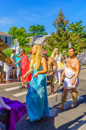 People walking in the 39th Annual Provincetown Carnival Gods and Goddess Parade on Commercial Street in Provincetown, Massachusetts August 17, 2017 USAのeditorial素材