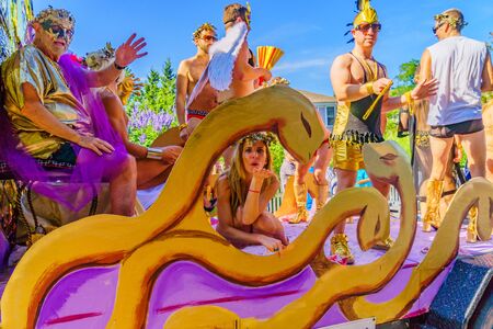People walking in the 39th Annual Provincetown Carnival Gods and Goddess Parade on Commercial Street in Provincetown, Massachusetts August 17, 2017 USAのeditorial素材