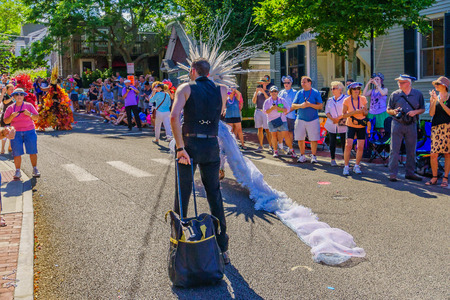 People walking in the 39th Annual Provincetown Carnival Gods and Goddess Parade on Commercial Street in Provincetown, Massachusetts August 17, 2017 USAのeditorial素材