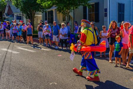 People walking in the 39th Annual Provincetown Carnival Gods and Goddess Parade on Commercial Street in Provincetown, Massachusetts August 17, 2017 USAのeditorial素材