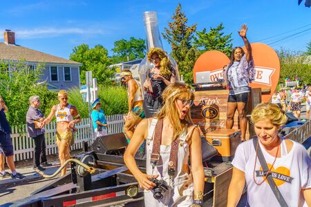 People walking in the 39th Annual Provincetown Carnival Gods and Goddess Parade on Commercial Street in Provincetown, Massachusetts August 17, 2017 USAのeditorial素材