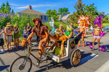 People walking in the 39th Annual Provincetown Carnival Gods and Goddess Parade on Commercial Street in Provincetown, Massachusetts August 17, 2017 USAのeditorial素材