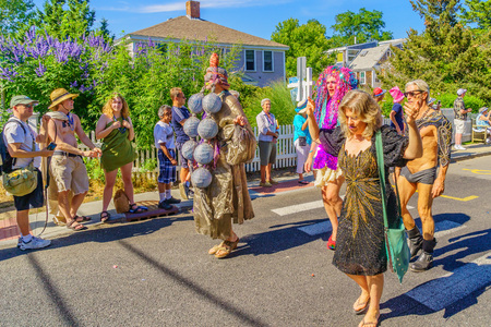 People walking in the 39th Annual Provincetown Carnival Gods and Goddess Parade on Commercial Street in Provincetown, Massachusetts August 17, 2017 USAのeditorial素材