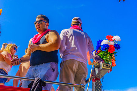 People walking in the 39th Annual Provincetown Carnival Gods and Goddess Parade on Commercial Street in Provincetown, Massachusetts August 17, 2017 USAのeditorial素材
