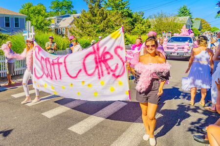 People walking in the 39th Annual Provincetown Carnival Gods and Goddess Parade on Commercial Street in Provincetown, Massachusetts August 17, 2017 USAのeditorial素材