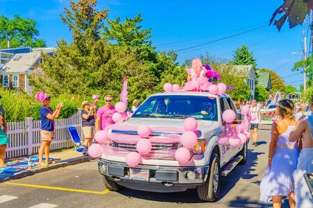 People walking in the 39th Annual Provincetown Carnival Gods and Goddess Parade on Commercial Street in Provincetown, Massachusetts August 17, 2017 USAのeditorial素材