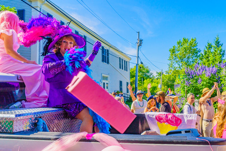 People walking in the 39th Annual Provincetown Carnival Gods and Goddess Parade on Commercial Street in Provincetown, Massachusetts August 17, 2017 USAのeditorial素材