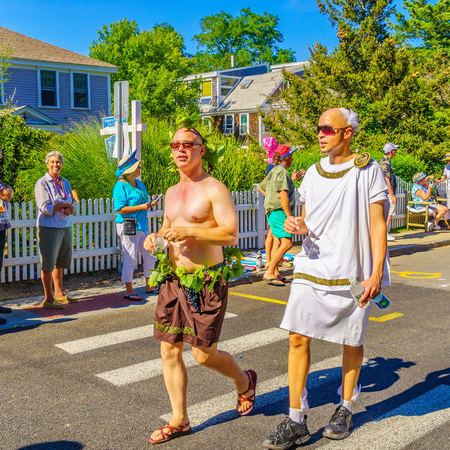 People walking in the 39th Annual Provincetown Carnival Gods and Goddess Parade on Commercial Street in Provincetown, Massachusetts August 17, 2017 USAのeditorial素材