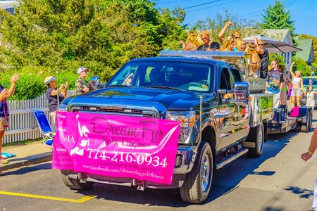 People walking in the 39th Annual Provincetown Carnival Gods and Goddess Parade on Commercial Street in Provincetown, Massachusetts August 17, 2017 USAのeditorial素材