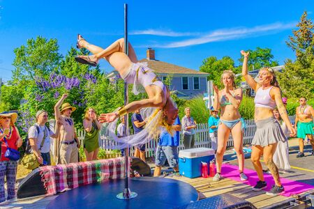 People walking in the 39th Annual Provincetown Carnival Gods and Goddess Parade on Commercial Street in Provincetown, Massachusetts August 17, 2017 USAのeditorial素材