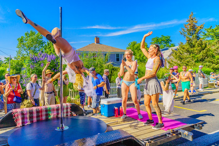 People walking in the 39th Annual Provincetown Carnival Gods and Goddess Parade on Commercial Street in Provincetown, Massachusetts August 17, 2017 USAのeditorial素材