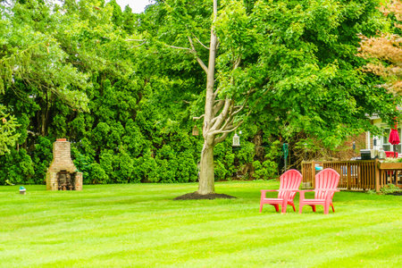 Amish country two red armchairs, antique lanterns hanging on a tree in Lancaster, PA