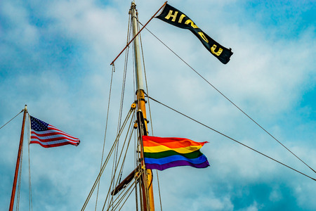 Three flags on yachts masts in Provincetown' marina, Massachusetts USの写真素材