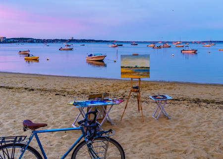 Provincetown, MA, USA - August 12 2017 Canvas, easel, bicycle, ships and boats in the Provincetown Marina during sunsetのeditorial素材