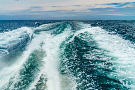 Sea water foam Ship track in the ocean Water texture. Ocean view Marine travel Cape cod Massachusetts USの写真素材