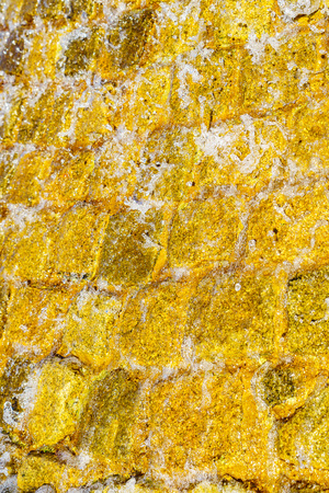 stone masonry with running water flowing down with water foam background textureの写真素材